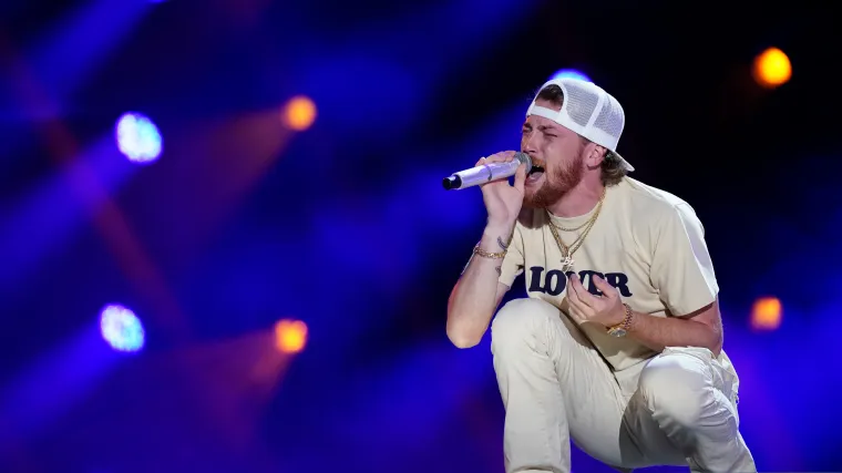 Bailey Zimmerman performing live on the 2026 Different Night Same Rodeo Tour stage with crowd energy.